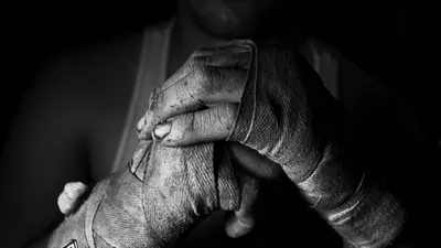 Gloves for MMA hang background black wall, banner fight sport. Generation  AI Stock Illustration | Adobe Stock