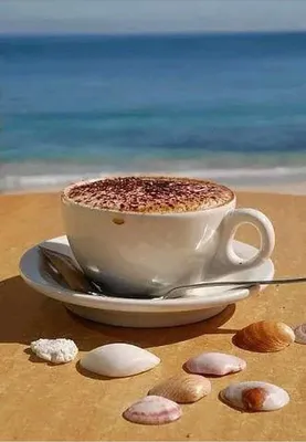 чашка кофе на столе на фоне моря Stock Photo | Adobe Stock